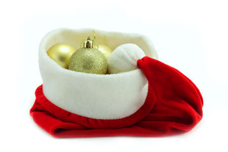 santa hat with Christmas balls isolated on whiteの写真素材