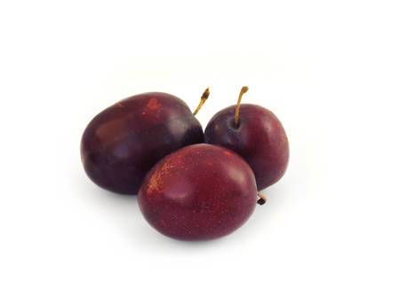 three plums on a white backgroundの写真素材