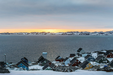 Sunset and colorful arctic houses at the Nuuk fjord, Nuuk Greenlandの写真素材