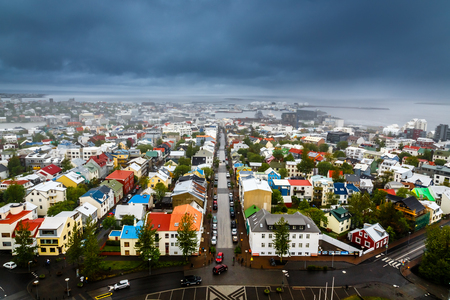Icelandic capital panorama, streets and colorful resedential buildings with fjord and mountains in the background, Reykjavik, Icelandの写真素材