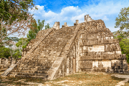 Small mayan pyramid in the forest, Chichen Itza archaeological site, Yucatan, Mexico