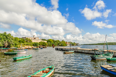 Jagua castle fortified walls with trees and fishing boats in the foreground, Cienfuegos province, Cubaのeditorial素材