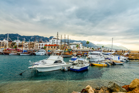 Kyrenia or Girne  historical city center, view to marina with many yachts and boats with mountains in the background, North Cyprusのeditorial素材