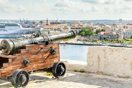 El Morro spanish fortress with cannon aimed to Havana city and liner docked in the port, Havana, Cubaの写真素材