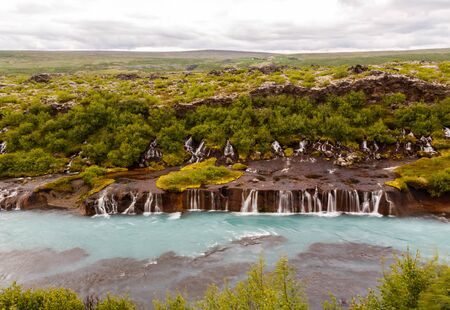 Hraunfossar waterfall streams falling into Hvita river, Husafell, Western Icelandの写真素材
