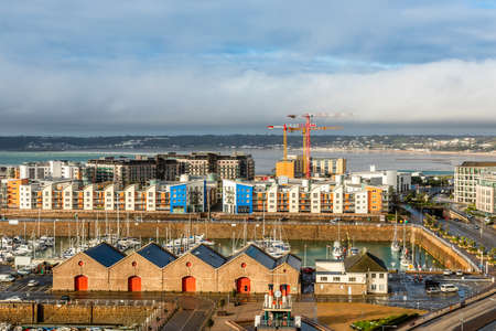 Saint Helier capital city panorama with port and marina in the foreground, bailiwick of Jersey, Channel Islandsの写真素材