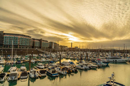 Sunset over marina, Saint Helier, bailiwick of Jersey, Channel Islandsの写真素材