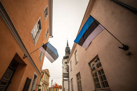 Estonan flags on the walls of old Tallinn town's houses, Estonia