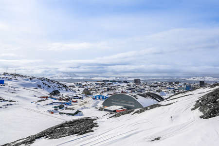 Nuuk city covered in snow with sea and mountains in the background, Greenlandの写真素材