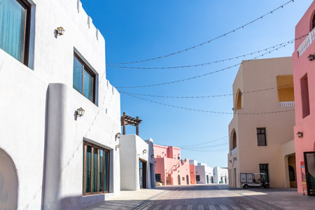 Colorful Mina village district street with arab traditional shaped buildings, Dohaの写真素材