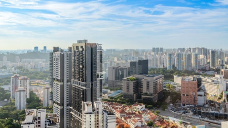Modern developing residential district with tall skyscrapers and green park in the foreground, Singaporeの写真素材
