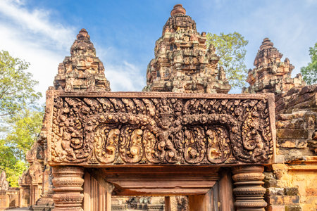 Hindu carving on the gate of hidden in jungles Banteay Srei khmer ruined temple, Angkor Archaeological Park, Siem Reap, Cambodiaの写真素材