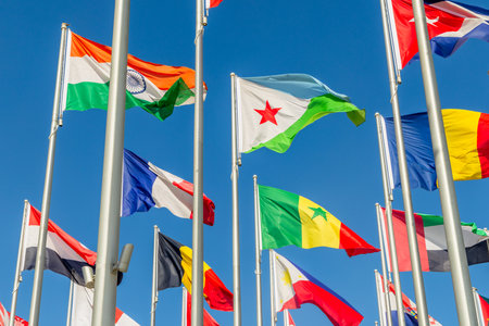Many worlds countries national flags waving on the wind, with Djibouti, French, Indian, Romanian and Senegal banners in the foreground, Doha, Qatarの写真素材