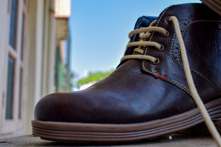 Side view of classic brown leather shoes isolated on blur background