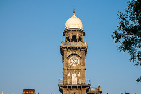 Front view of royal old exterior clock tower at shalini palace hotel, kolhapur city India.のeditorial素材