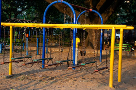 Stock photo of yellow and blue color painted climbing adventure equipment for kids, Picture captured at Rankala lake Kolhapur , Maharashtra, India. amusement concept. childhood memories.の写真素材