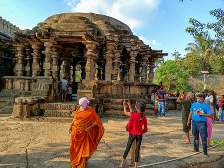 Khidrapur, India- November 6th 2021; exterior view of ancient Kopeshwar Mahadev temple, Beautiful carving revealed Hindu culture and traditions.tourist visiting temple and clicking pictures. sunny dayのeditorial素材