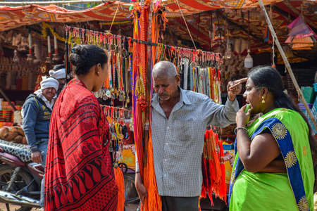 Tulajapur, India- December 19th 2019; Stock photo of middle age Indian street vendor selling...