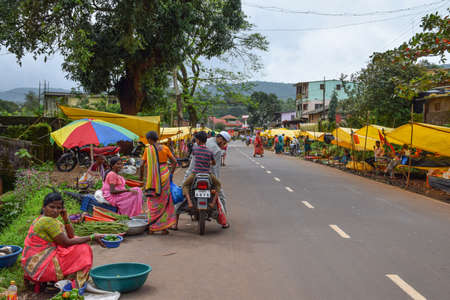 Kolhapur ,India- September 15th 2019; stock photo of Indian village market area or village weekly bazaar.village street vendor selling vegetables, groceries, cloths and common goods, in small village.のeditorial素材