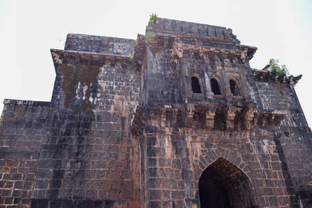 Panhala,Maharashtra,India-May 5th 2019;stock photo of popular ancient Panhala fort near kolhapur city,front door of a ancient fort constructed using black rocks.Picture captured under bright sunlightのeditorial素材
