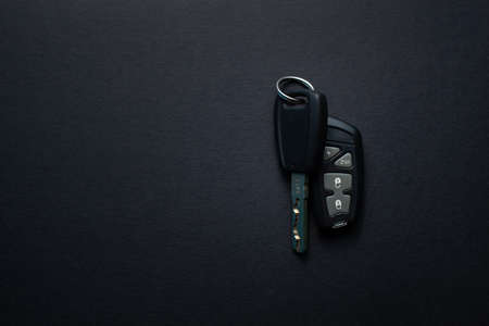 Car keys with remote from car alarm on isolated black backgroundの写真素材