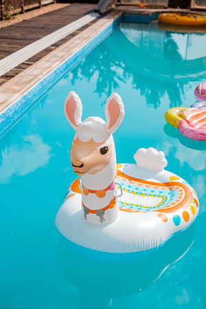 Inflatable raft in the form of a llama for swimming in the poolの写真素材