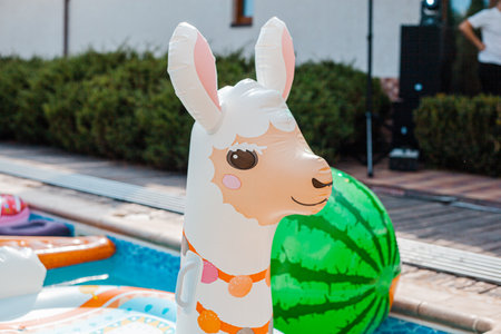 Inflatable raft in the form of a llama for swimming in the poolの写真素材