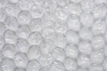 Large bubble wrap detail view with side lightingの写真素材