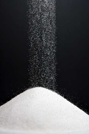 Sugar Falling Into Pileの写真素材