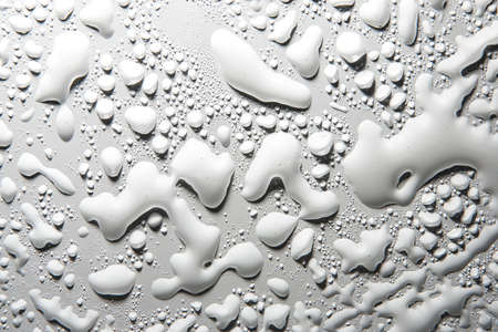 Milk White Drops on Surface and Dramatic Shadowの写真素材