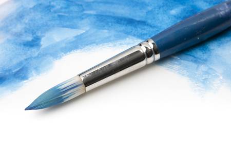 Watercolor Paintbrush on Painted Surfaceの写真素材