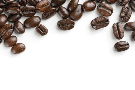 Coffee beans on white background. Heap out from edge for border design element