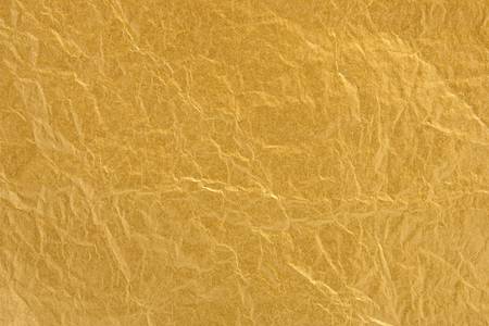 Gold foil texture with focus across entire surfaceの写真素材