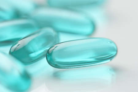 High key shot of white pills brightly lit.の写真素材