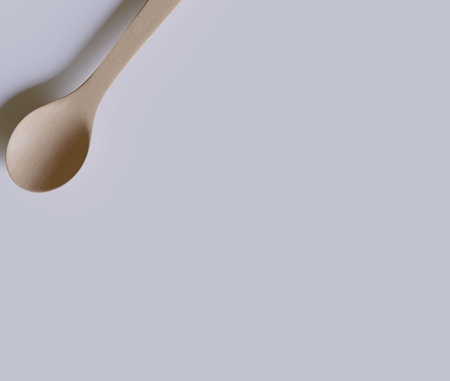 Wooden spoon on a white background. Copy space for text.の写真素材