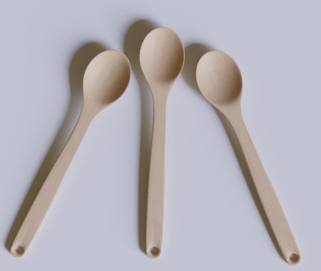 Wooden spoons on a white background. View from above.の写真素材