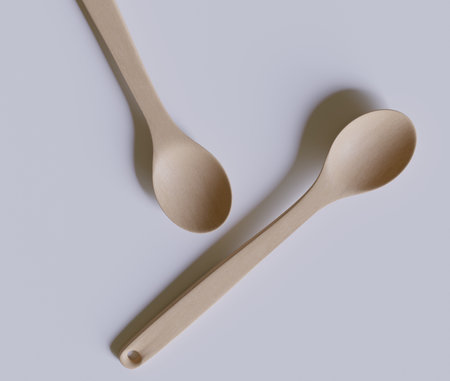 Wooden spoons on a white background. Minimalism.の写真素材