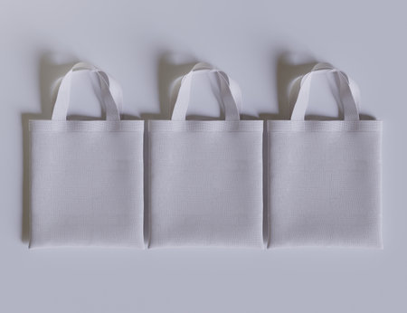 White cotton bag on a gray background. Top view. Copy space.の写真素材