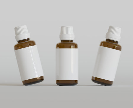 3d render of two brown medical bottles with blank label on gray backgroundの写真素材
