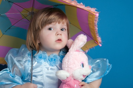 little girl with toy and umbrella の写真素材
