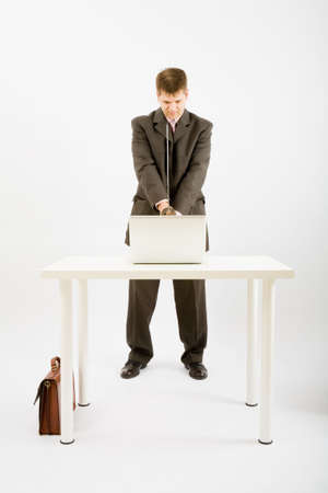 Business man kill the laptop with a samurai swordの写真素材