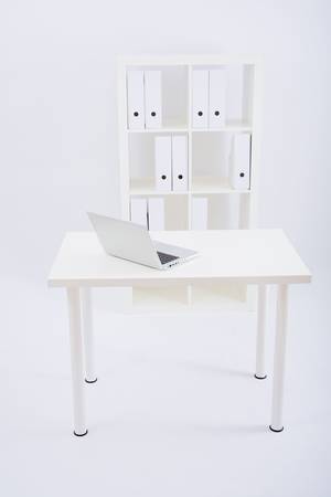 Moder office workplace with white furnituresの写真素材
