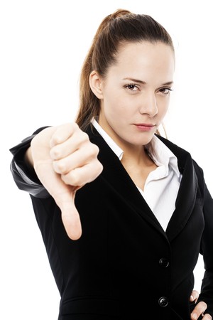 severe businesswoman with thumb down on white background studio