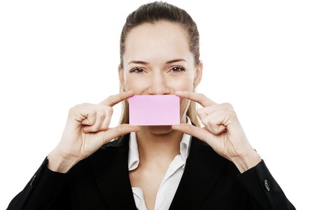 Young businesswoman holding sheets of paper on white background studioの写真素材