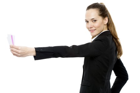 Young businesswoman holding sheets of paper on white background studioの写真素材