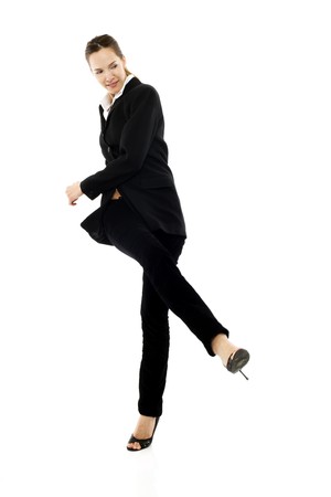young businesswoman kicking on white background studioの写真素材