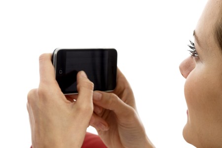 young woman with smart phone on white background studioのeditorial素材