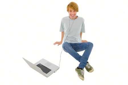 teenage boy with laptopの写真素材