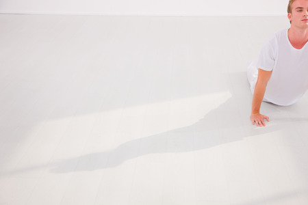 Young man practicing yogaの写真素材