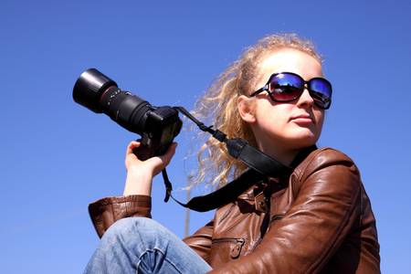 Girl with cameraの写真素材